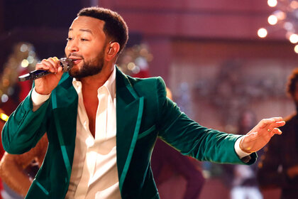 John Legend performing on The Voice stage