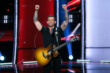 Singer performing on The Voice stage