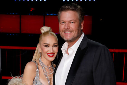 Blake Shelton and Gwen Stefani posing and smiling together