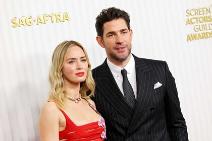 Emily Blunt and John Krasinksi posing together on the red carpet.