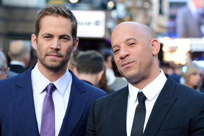 Paul Walker and Vin Diesel pose on the 'Fast And Furious 6' red carpet together