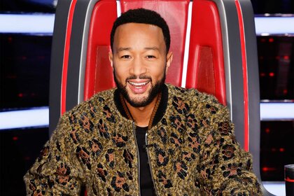John Legend sits in his coaches chair on the voice episode 2415