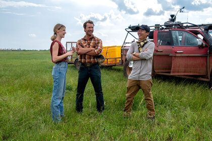 Daisy Edgar-Jones, Glen Powell, and Director Lee Isaac Chung on the set of Twisters