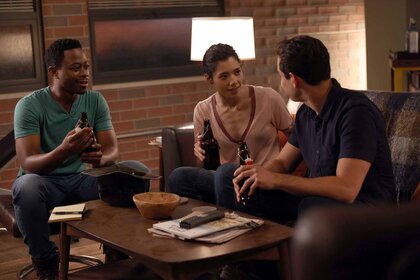 Darren Ritter, Violet, and Blake Gallo chat around a coffee table in Chicago Fire Episode 1001.