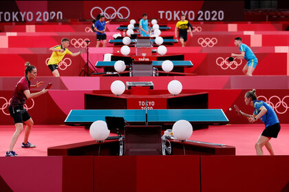 Several table tennis games happen simultaneously at the 2020 Tokyo Olympic Games