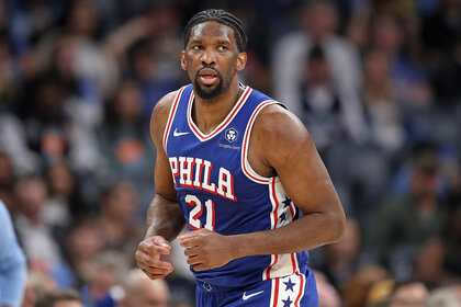Joel Embiid runs on the court during a basketball game against the Memphis Grizzlies