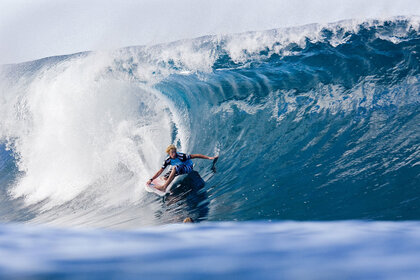 John John Florence of Hawaii grabs a rail as he rides backside