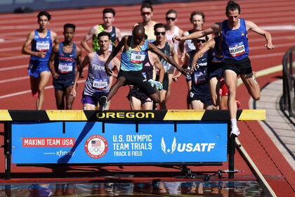 Hillary Bor and Matthew Wilkinson compete in the first round of the men's 3000 meter steeplechase