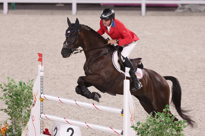 Boyd Martin during a jump with his horse during the 2020 olympics