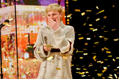 Reid Wilson on stage after winning the golden buzzer on America's Got Talent Episode 1906