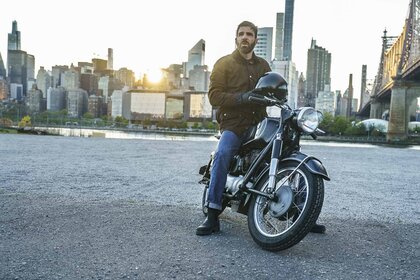 Dr. Oliver Wolf (Zachary Quinto) rides a motorcycle in Brilliant Minds Episode 101.