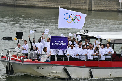 The Refugee Olympic Team on the boat during the 2024 Olympics Opening Ceremony