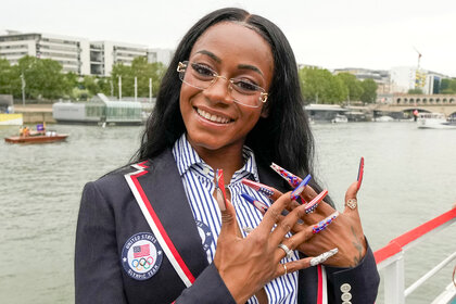 Sha'Carri Richardson on the boat showing her nails off at the 2024 olympics opening ceremony