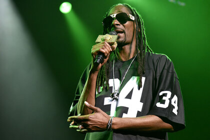 Snoop Dogg performing onstage in 2016.