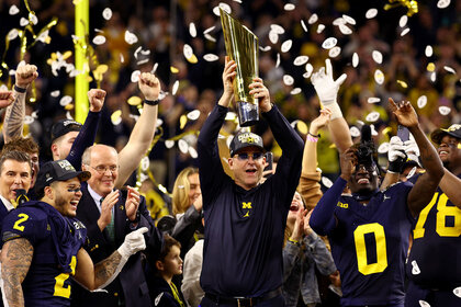 Head coach Jim Harbaugh of the Michigan Wolverines celebrates after defeating the Washington Huskies 34-13 in the 2024 CFP National Championship game