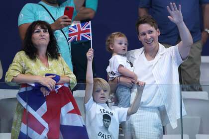 Debbie Daley, mother of Thomas Daley, Dustin Lance Black, husband of Thomas Daley, and their children are seen in attendance as they show their support ahead of the Men’s Synchronised 10m Platform Final