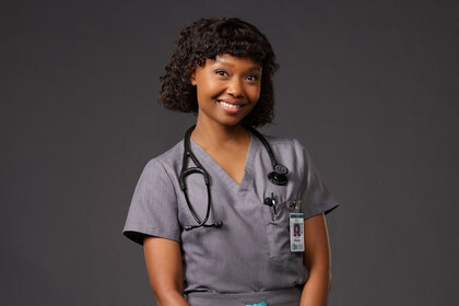 Ashleigh Lathrop poses as Dr. Ericka Kinney in a Brilliant Minds promotional image