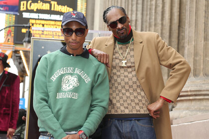 Pharrell Williams and Snoop Dogg pose together at Snoop Dogg's Hollywood Walk of Fame star ceremony in 2018