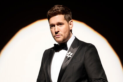 Michael Buble wears a black tuexdo for Season 26 of The Voice