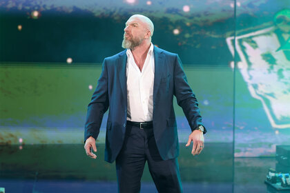 Triple H looks at the crowd on stage during SmackDown