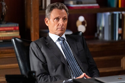 Nicholas Baxter sits at his desk on Law and Order Season 24 Episode 4