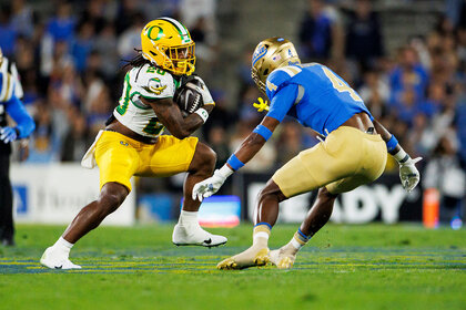 Running back Jordan James #20 of the Oregon Ducks carries the ball during the first quarter of an NCAA college football game