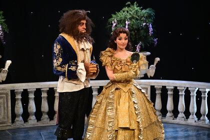 Pete Davidson and Chloe Fineman as belle and the beast on a balcony during Saturday Night Live Season 47 Episode 12