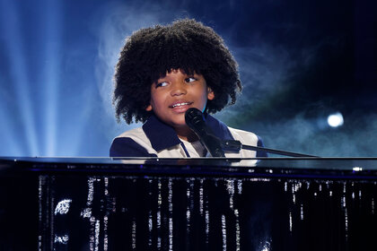 Journeyy plays the piano and sings on stage on America's Got Talent Season 19 Episode 13