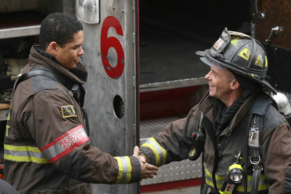 Peter Mills shakes hands with Christopher Herrmann on Chicago Fire Season 2 Episode 12