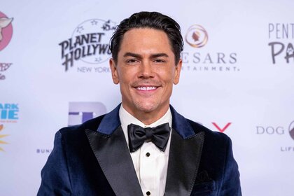 Tom Sandoval smiles in a tuxedo.