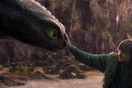 Hiccup (Mason Thames) touches his dragons snout in the live-action How to Train Your Dragon