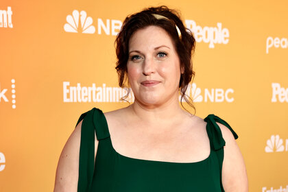 Allison Tolman wears a dark green dress on the red carpet