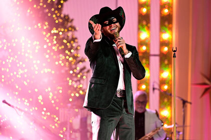 Orville Peck sings on stage during Little Big Town’s Christmas at the Opry