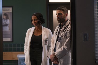 Dr. Carol Pierce (Tamberla Perry) and Dr. Oliver Wolf (Zachary Quinto) stand in doctor's coats in Brilliant Minds Episode 112.