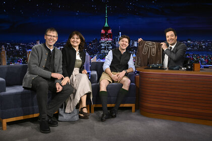 Jimmy Fallon holding up shorts with the Ewerdwalbesloh family.