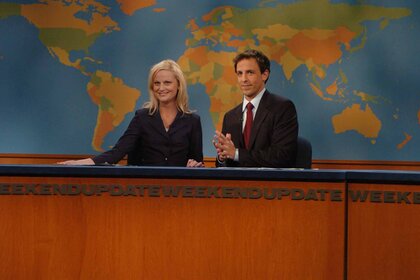 Amy Poehler and Seth Meyers sit in front of the Weekend Update map on SNL Episode 3204.