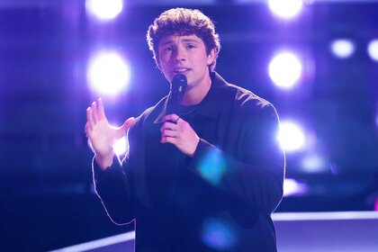 Britton Moore performing on stage on The Voice Season 27, Episode 2.