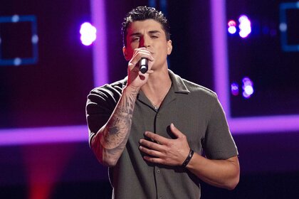 Jonny Rey performing on stage on The Voice Season 27, Episode 3.