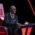 Snoop Dogg sits in a judge's chair on The Voice Season 26 Episode 10.