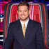 Michael Bublé smiling in the coaches chair on The Voice Season 27, Episode 1.