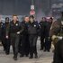 Officer Adam Ruzek (Patrick John Flueger) and Desk Sgt. Trudy Platt (Amy Morton) walk with a large group of cops in Chicago Fire Episode 1311.