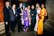 Mikey Day, Molly Kearney, James Austin Johnson, Sarah Sherman, Chloe Fineman, Bowen Yang, Heidi Gardner and Ego Nwodim posing for photos in a hallway.