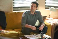 Brett Dalton as Jason Pelham sitting on a couch looking up Chicago Fire