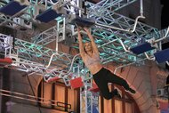 Caitlyn Bergstrom-Wright competes on an American Ninja Warrior course.
