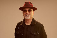 Howie Mandel wears sunglasses and a hat for AGT season 19