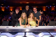 The judges for AGT sit at the judges table on AGT Episode 1904