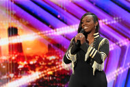 Dee Dee Simon smiles onstage during America's Got Talent, Season 19 Episode 3.