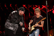 Jelly Roll and Keith Urban perform onstage during the 2024 CMA Music festival