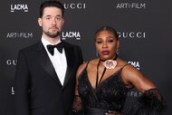 Alexis Ohanian and Serena Williams on a red carpet in a tux and black dress