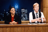 Julia Louis-Dreyfus and Brad Hall during "Saturday Night News" on SNL in 1983